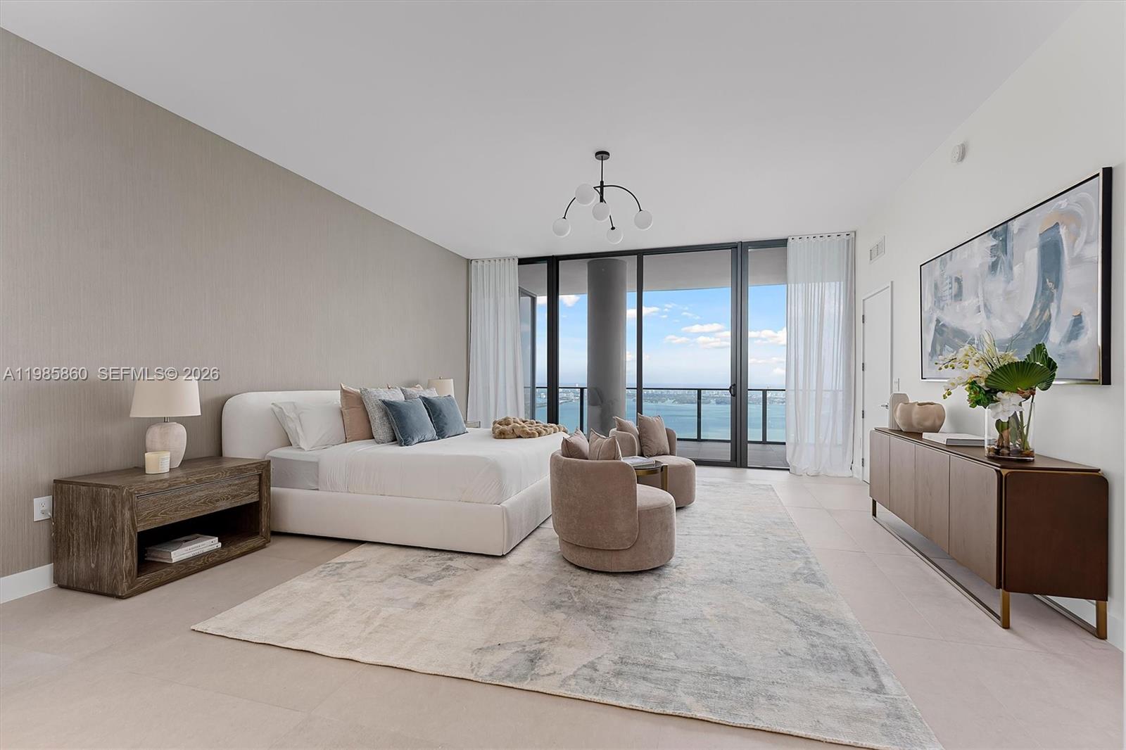 700 Northeast 24th Street, Unit PH5802 Miami, FL 33137 - Photo 13 of 59 a living room with furniture and a large window