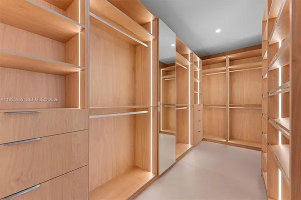 a bedroom with a bed and a night stand