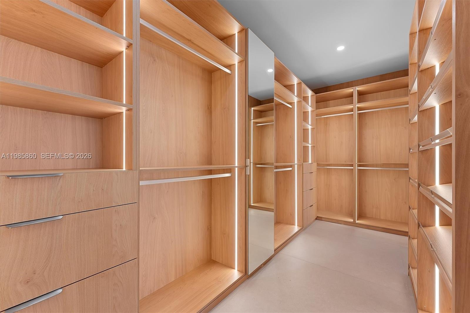 700 Northeast 24th Street, Unit PH5802 Miami, FL 33137 - Photo 17 of 59 a view of walk in closet with wooden floor