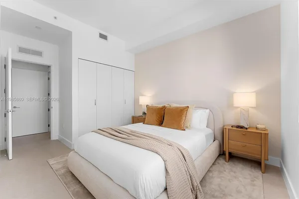 a bedroom with a bed and closet