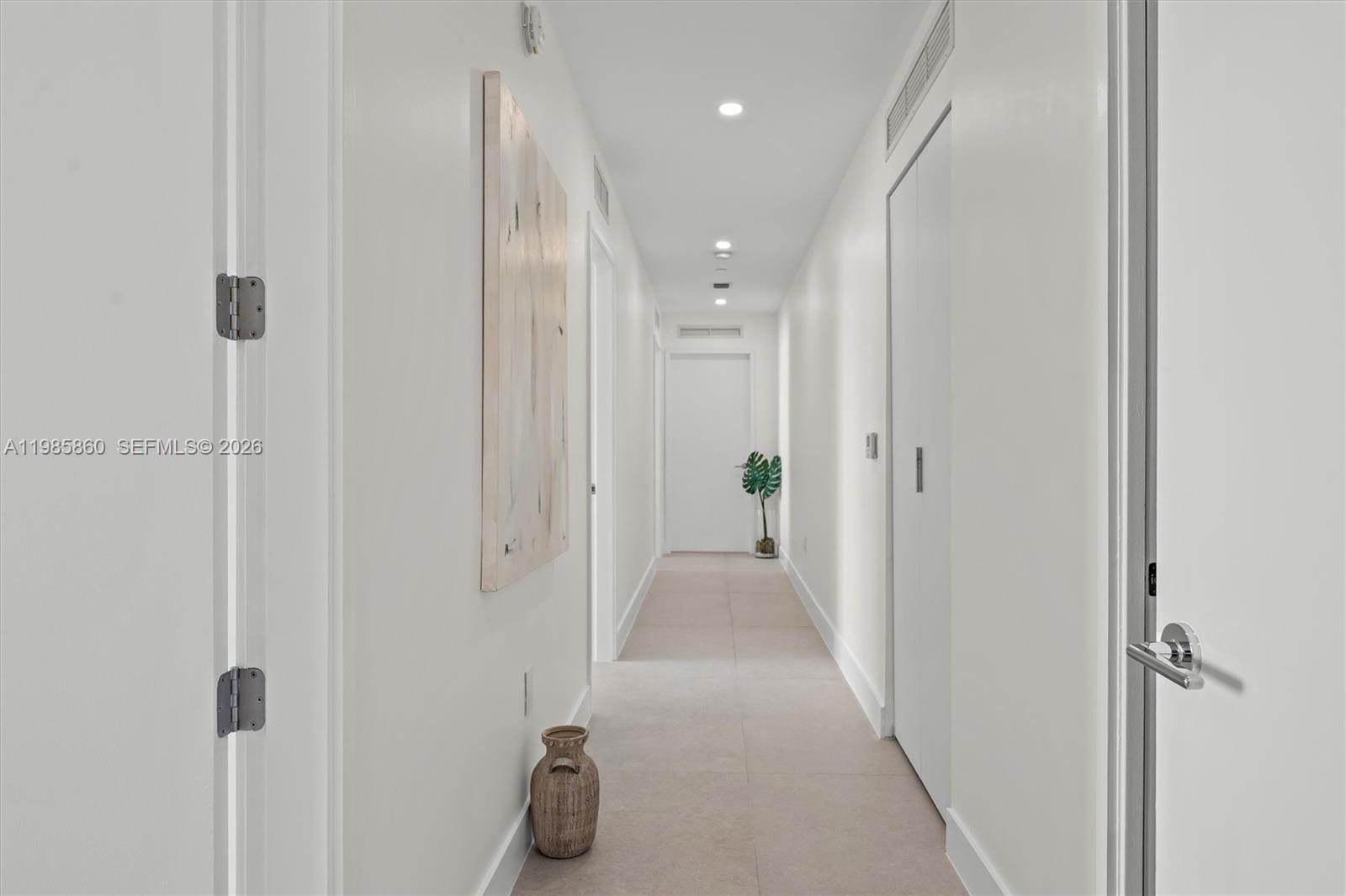 700 Northeast 24th Street, Unit PH5802 Miami, FL 33137 - Photo 23 of 59 a view of a hallway with closet and a shower