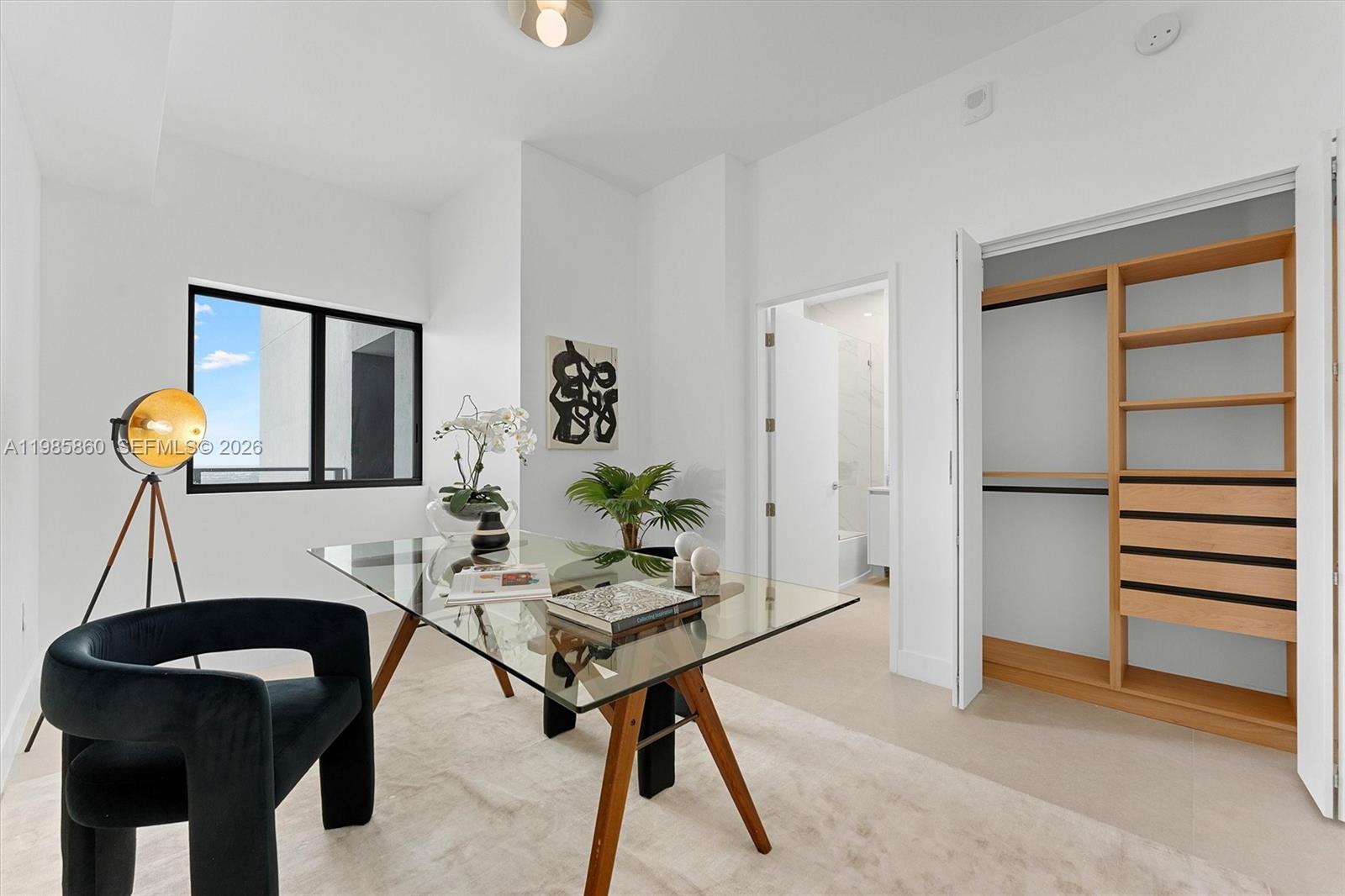 700 Northeast 24th Street, Unit PH5802 Miami, FL 33137 - Photo 26 of 59 a living room with furniture a dining table and paintings on the wall