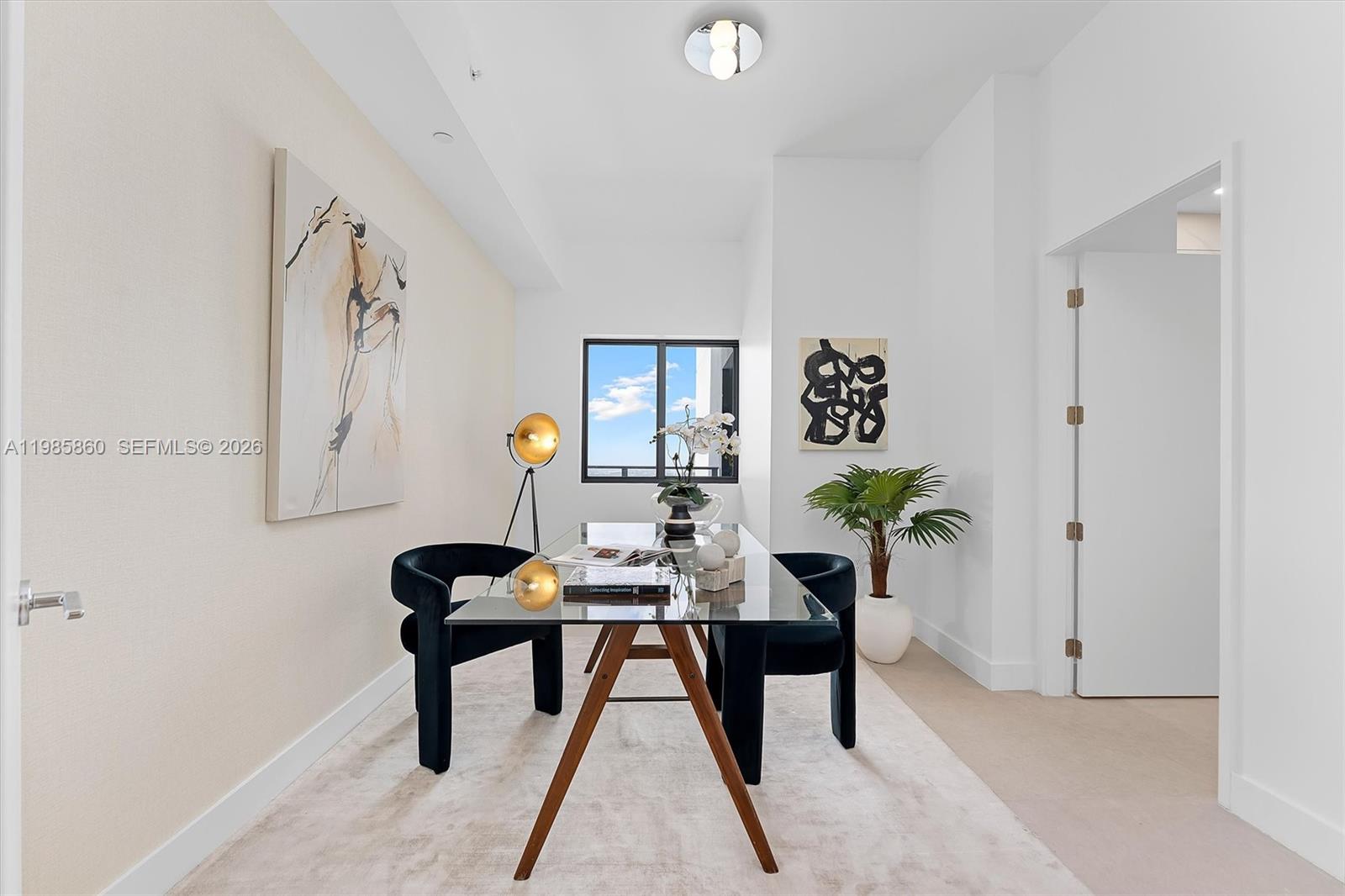 700 Northeast 24th Street, Unit PH5802 Miami, FL 33137 - Photo 27 of 59 a living room with furniture and a potted plant