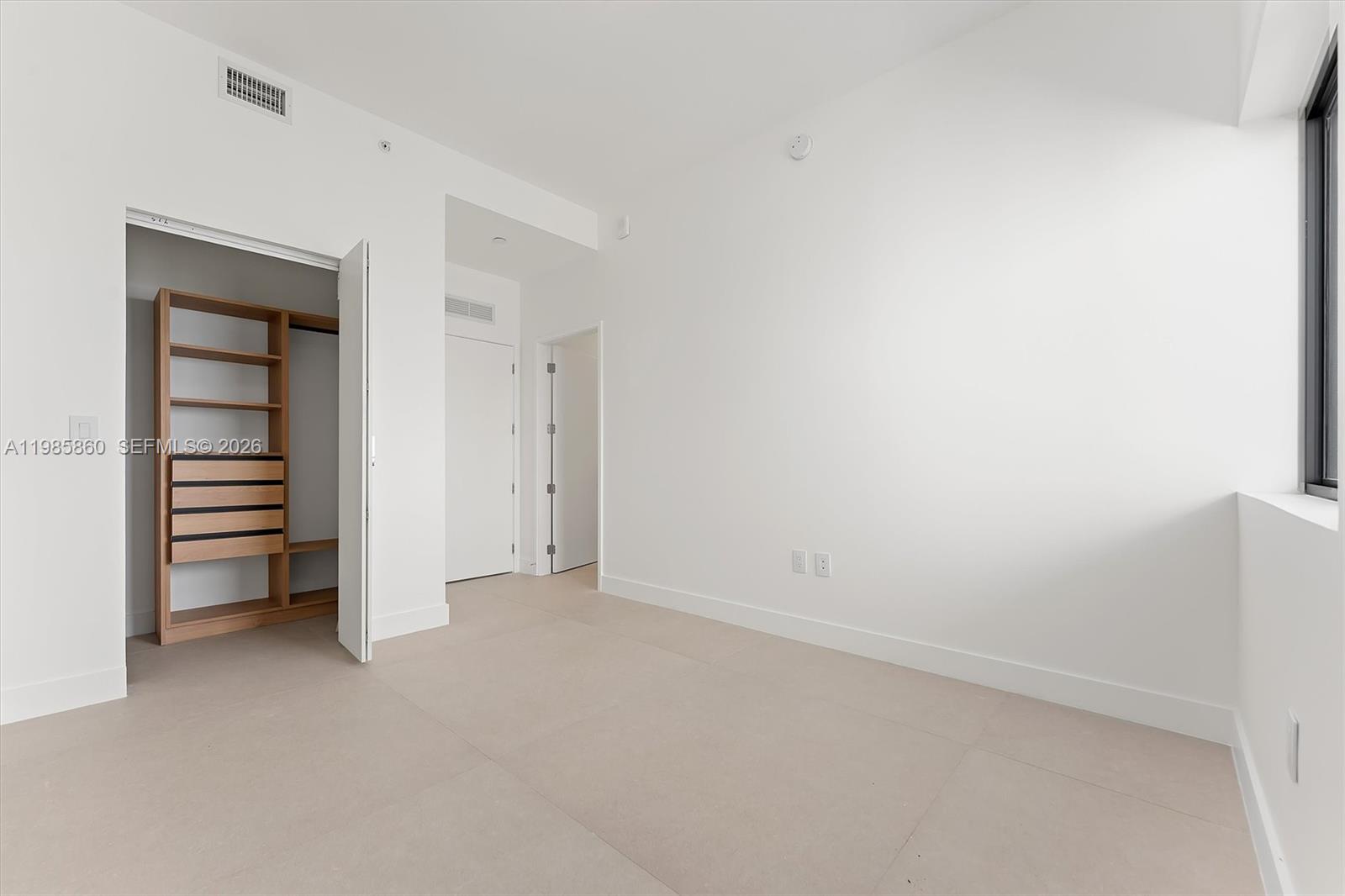 700 Northeast 24th Street, Unit PH5802 Miami, FL 33137 - Photo 31 of 59 a view of room with balcony and a closet