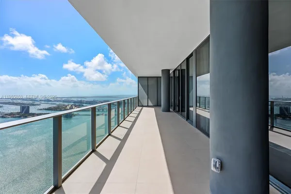 a view of a balcony with wooden floor