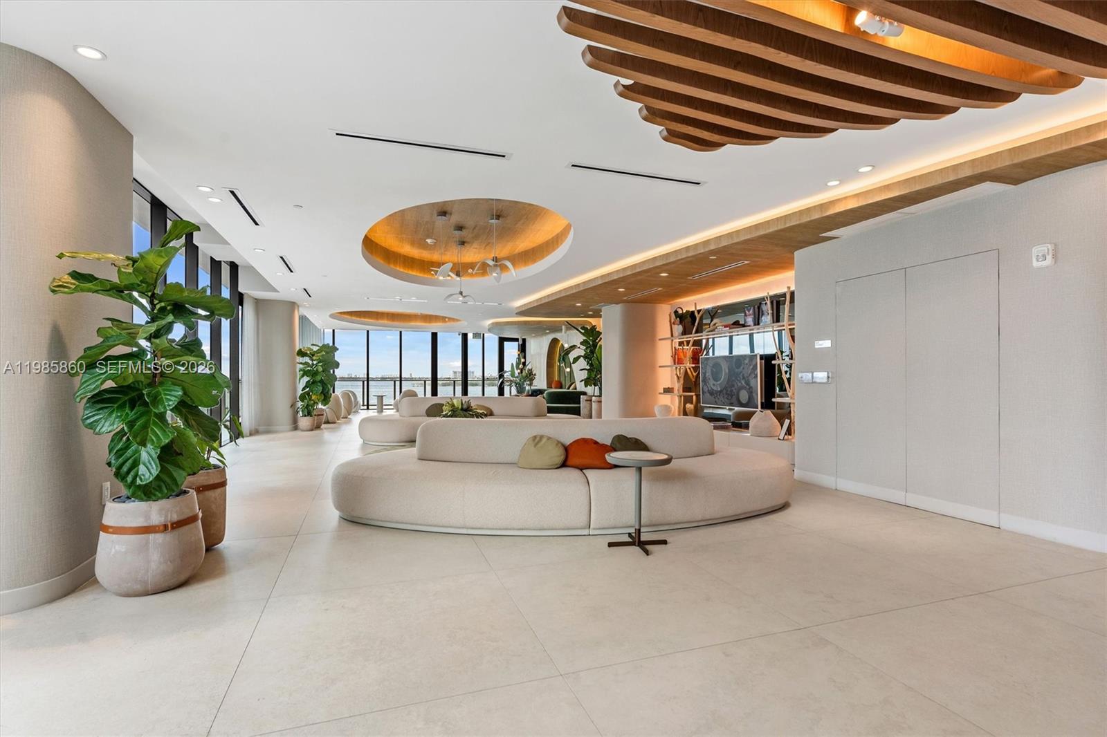 700 Northeast 24th Street, Unit PH5802 Miami, FL 33137 - Photo 58 of 59 a living room with furniture and potted plant