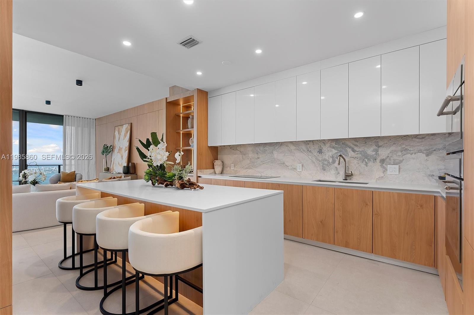 700 Northeast 24th Street, Unit PH5802 Miami, FL 33137 - Photo 8 of 59 a kitchen with stainless steel appliances granite countertop a sink and cabinets
