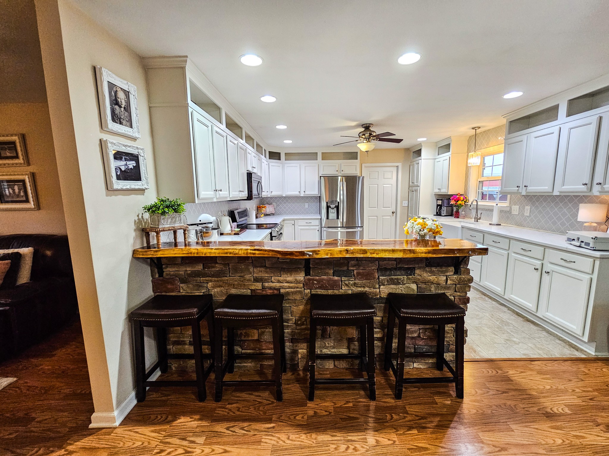 223 Rich Road Unionville, TN 37180 - Photo 11 of 31 a dining hall with stainless steel appliances kitchen island granite countertop furniture and wooden floor