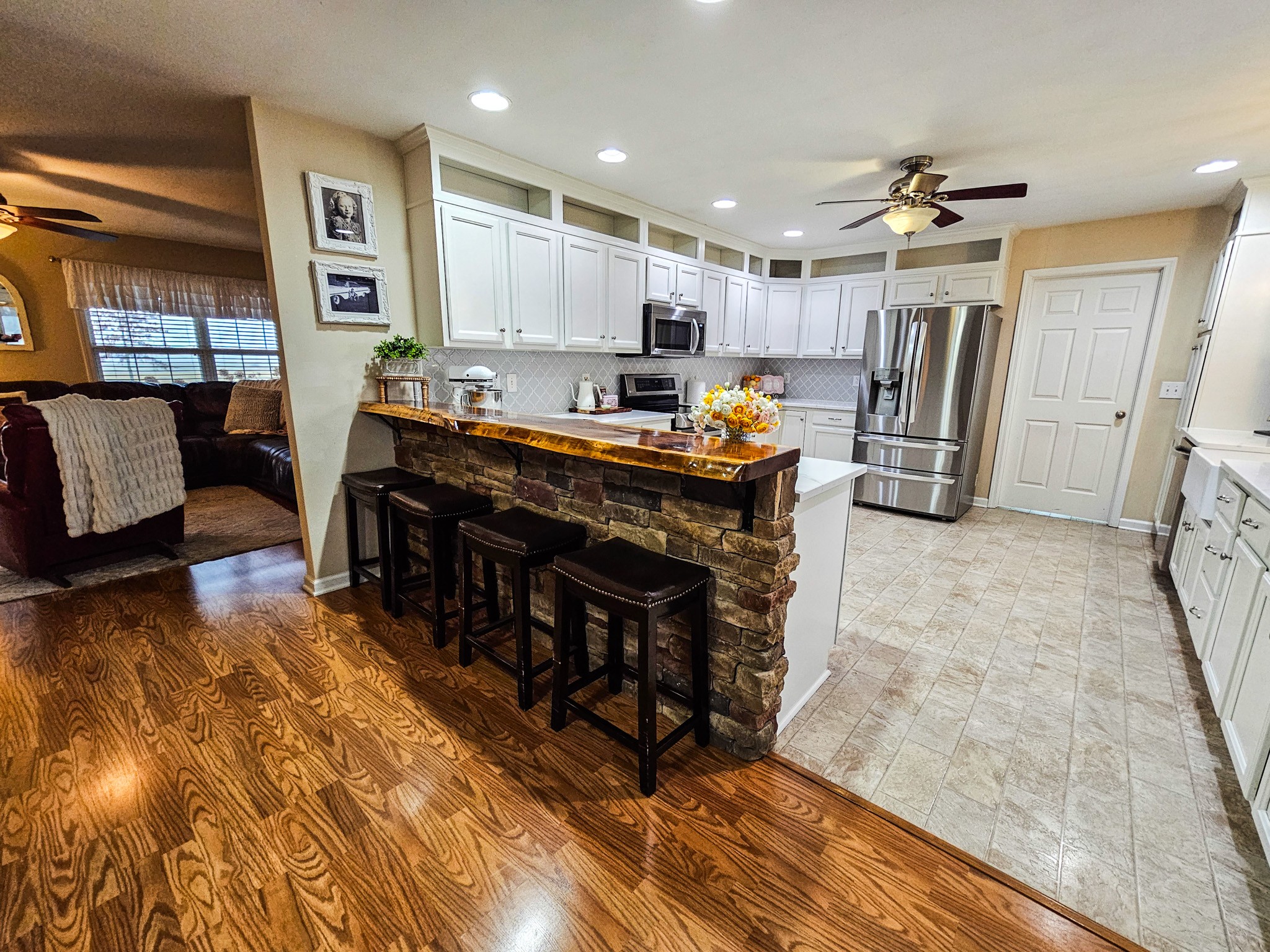 223 Rich Road Unionville, TN 37180 - Photo 12 of 31 a large kitchen with stainless steel appliances granite countertop a refrigerator and a stove top oven