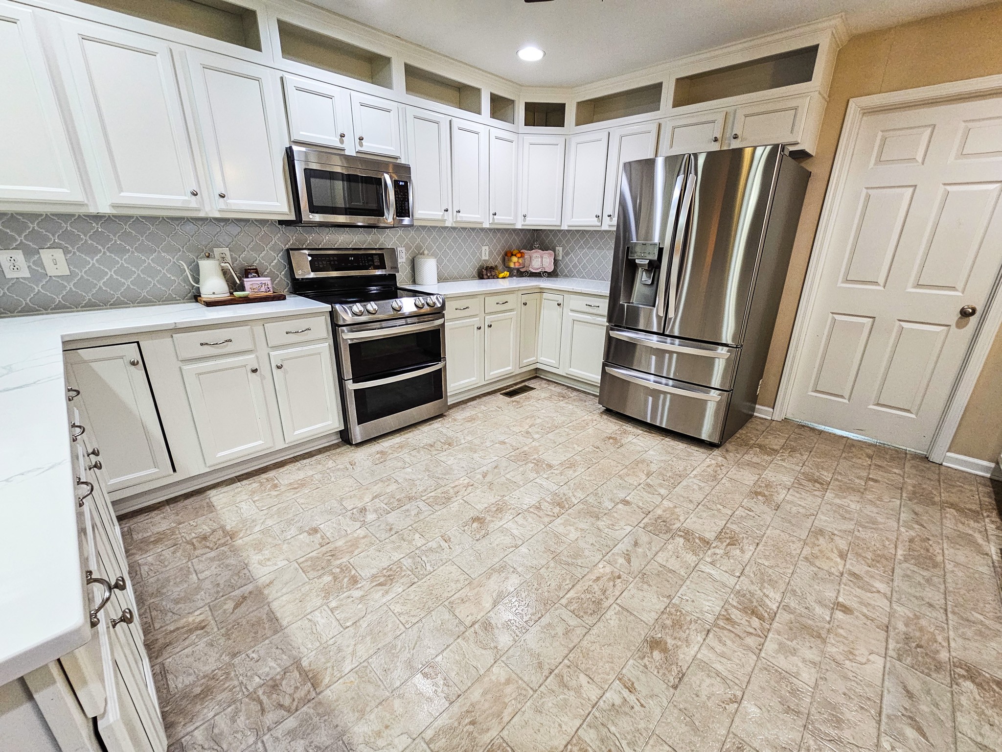 223 Rich Road Unionville, TN 37180 - Photo 13 of 31 a kitchen with a refrigerator sink and microwave