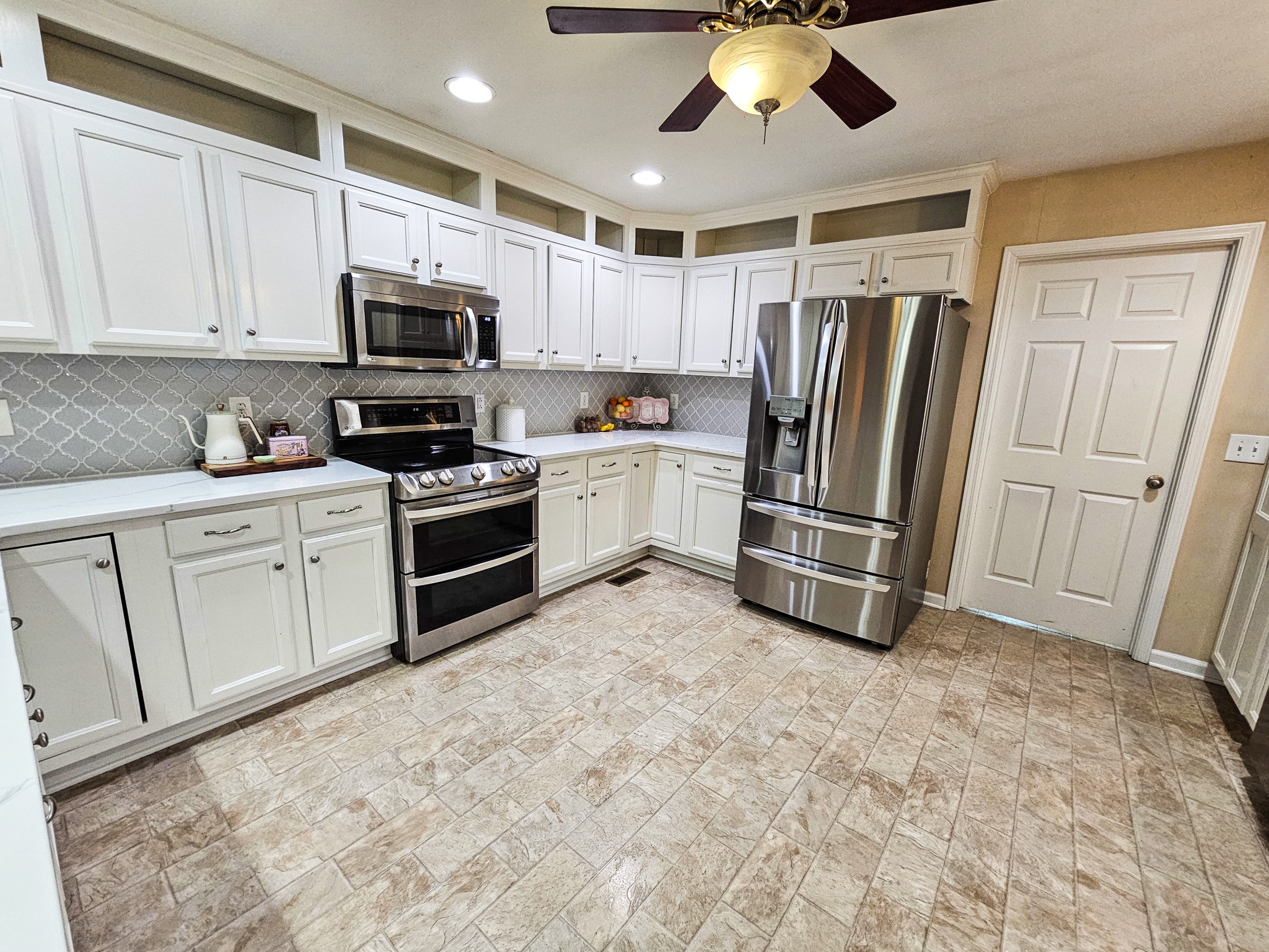 223 Rich Road Unionville, TN 37180 - Photo 15 of 31 a kitchen with stainless steel appliances a refrigerator sink and microwave