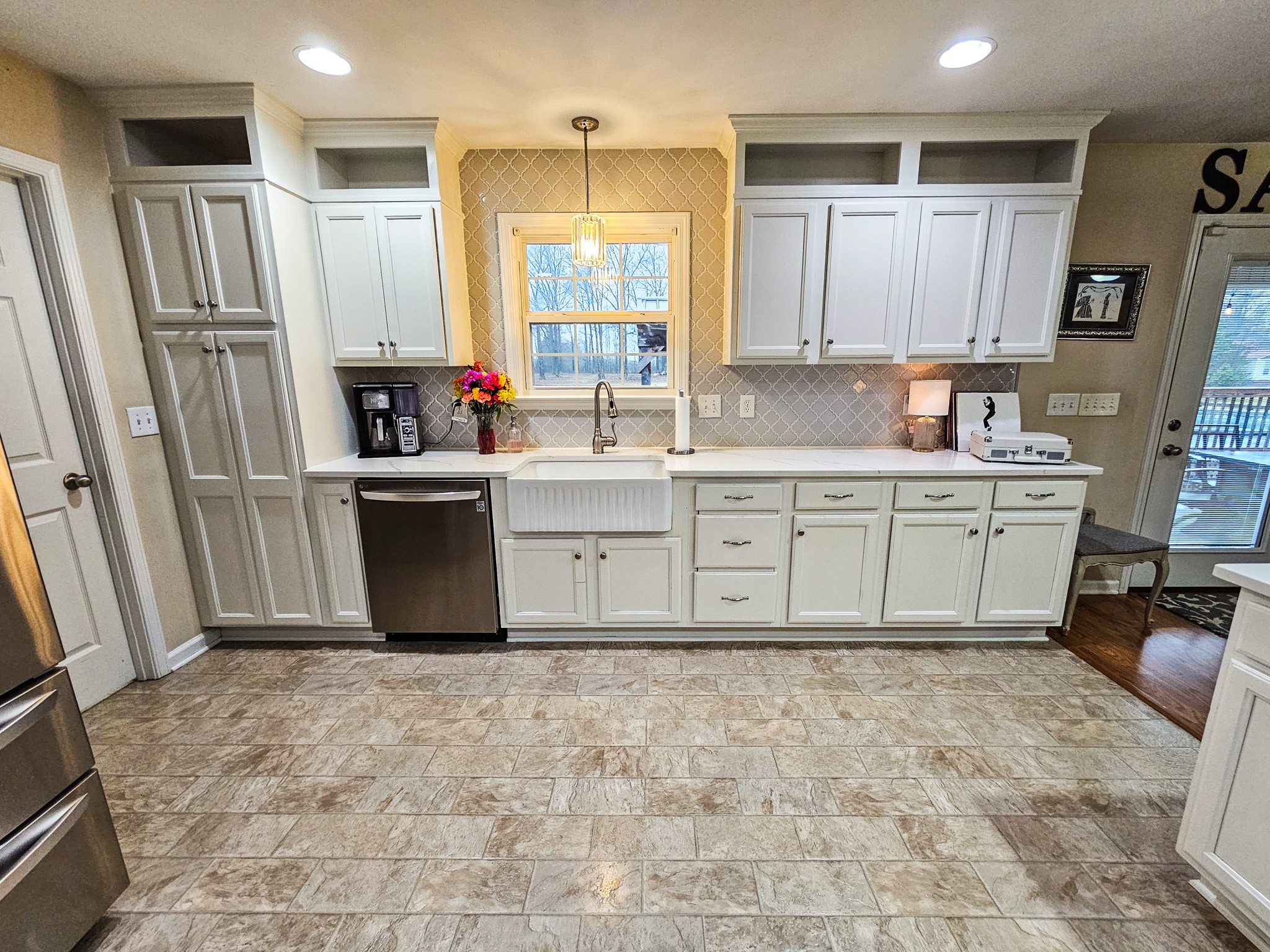 223 Rich Road Unionville, TN 37180 - Photo 16 of 31 a kitchen with granite countertop a refrigerator sink and cabinets