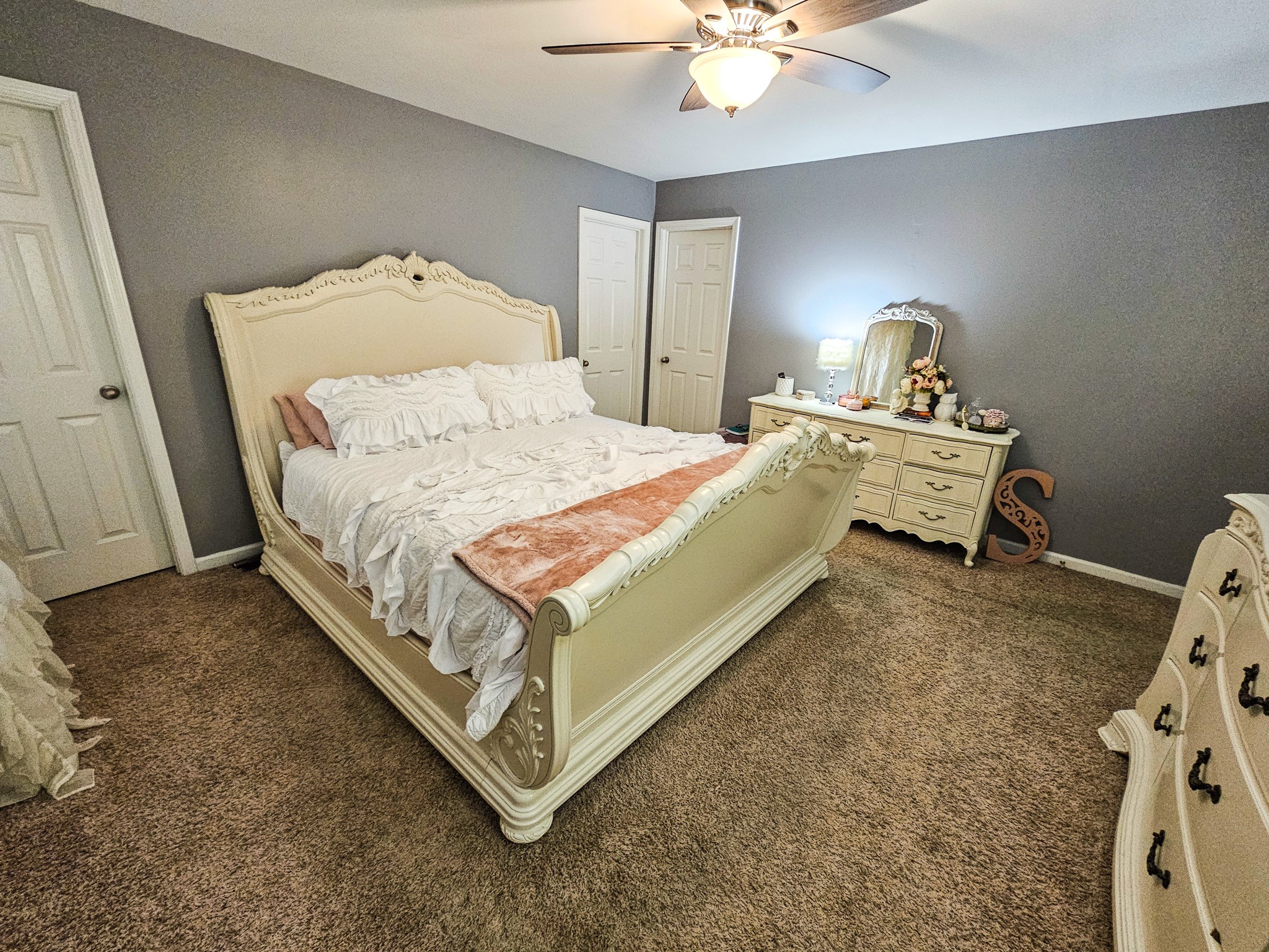 223 Rich Road Unionville, TN 37180 - Photo 18 of 31 a bedroom with a bed and a chandelier