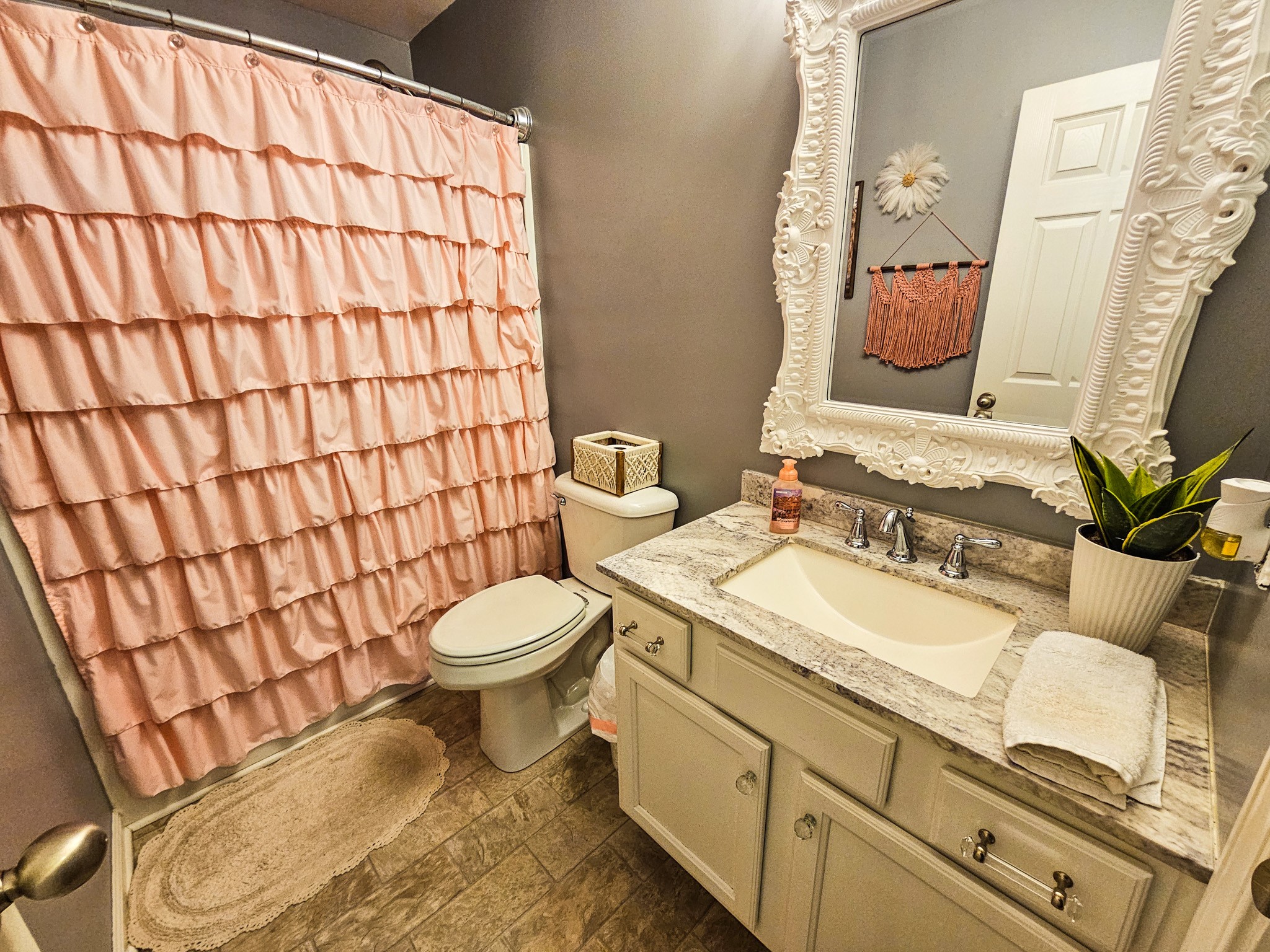 223 Rich Road Unionville, TN 37180 - Photo 24 of 31 a bathroom with a granite countertop toilet sink and mirror