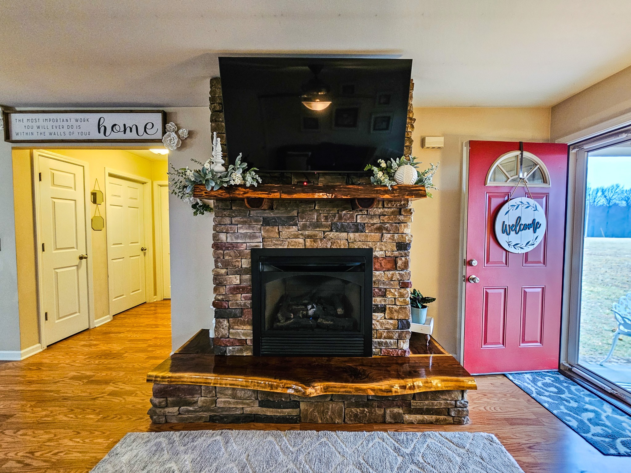 223 Rich Road Unionville, TN 37180 - Photo 4 of 31 a living room with a fireplace and a flat screen tv