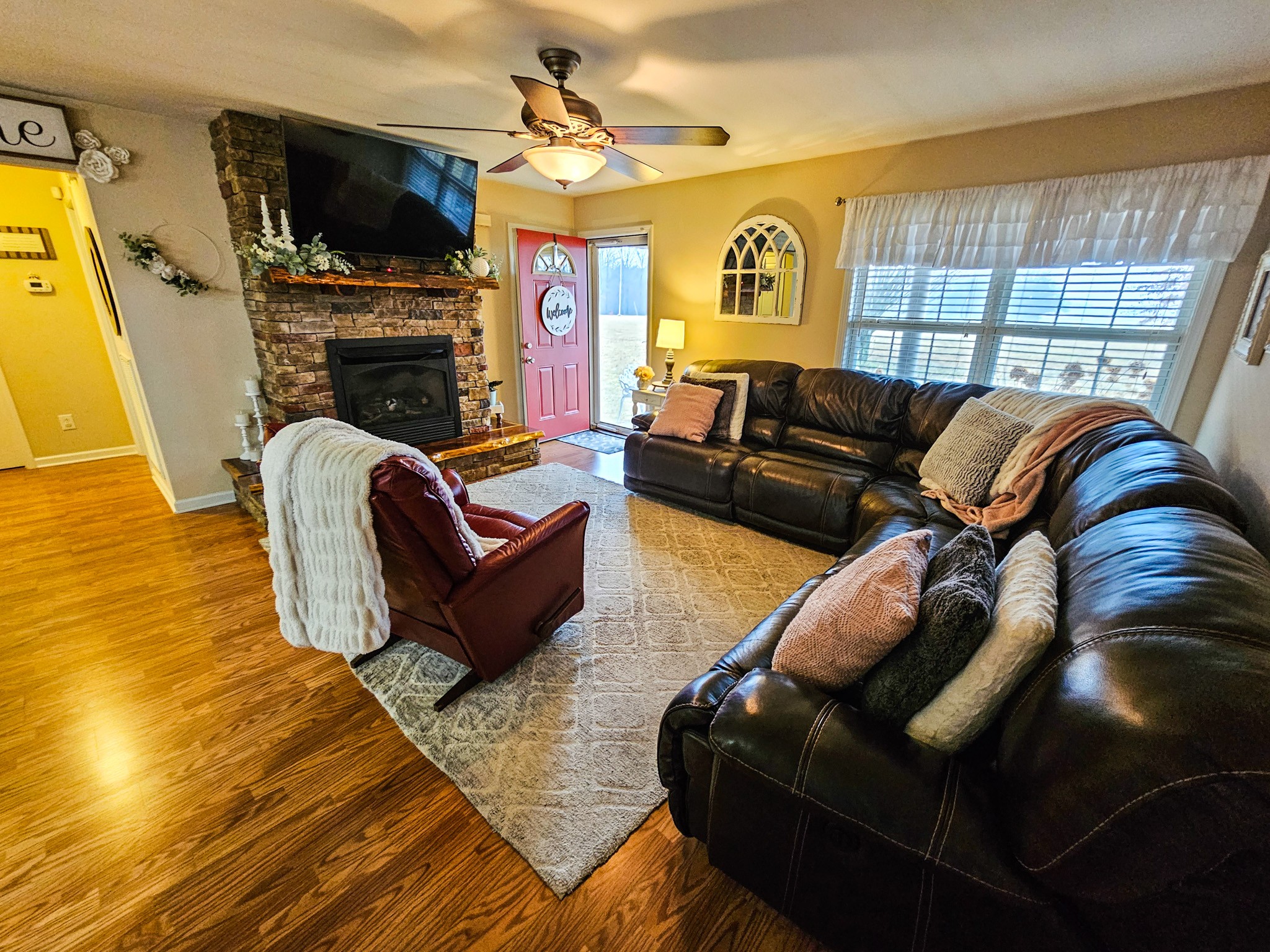 223 Rich Road Unionville, TN 37180 - Photo 5 of 31 a living room with furniture fireplace and a flat screen tv
