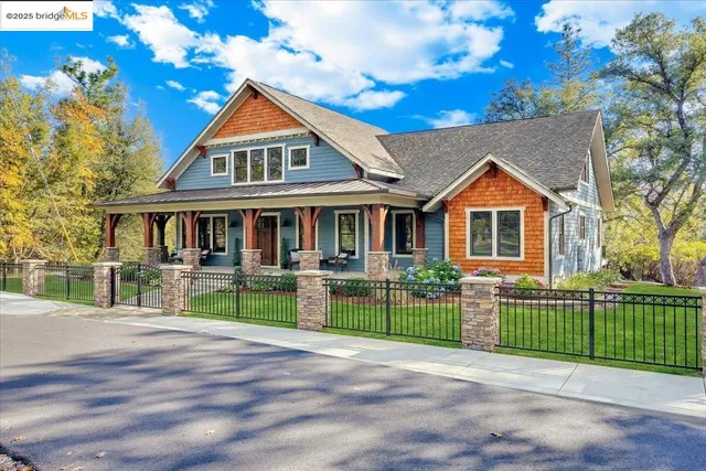 a front view of a house with a yard and porch