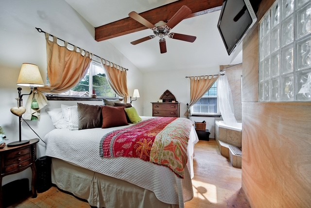 7031 Triola Lane Houston, TX 77074 - Photo 11 of 12 a bed room with a bed and a chandelier