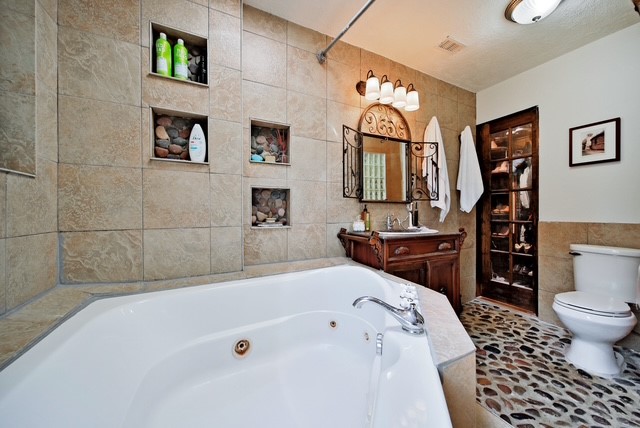 7031 Triola Lane Houston, TX 77074 - Photo 12 of 12 a bathroom with a sink a toilet and a bathtub