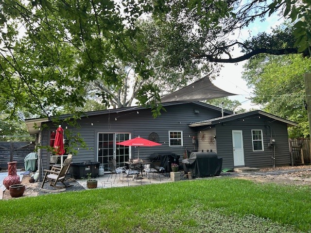 7031 Triola Lane Houston, TX 77074 - Photo 2 of 12 a view of a chair and table in backyard of the house