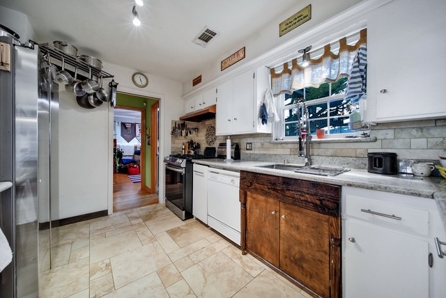 7031 Triola Lane Houston, TX 77074 - Photo 8 of 12 a kitchen with stainless steel appliances granite countertop a sink and cabinets