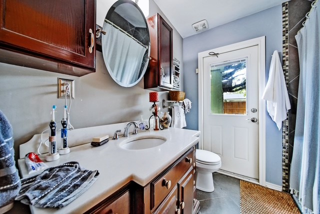 7031 Triola Lane Houston, TX 77074 - Photo 10 of 12 a bathroom with a sink toilet and mirror