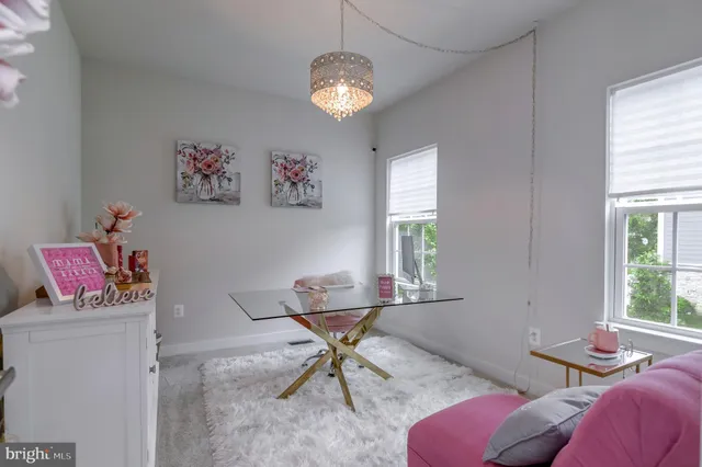 a en suite bathroom with a sink a mirror and a bathtub