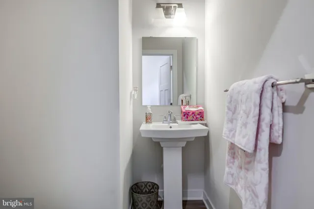 a white bath tub sitting next to a shower