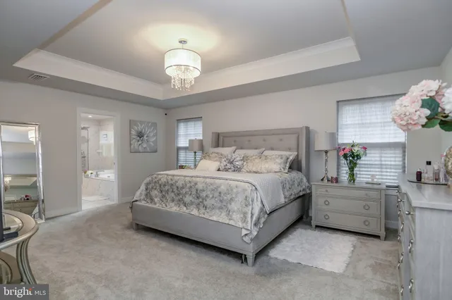 a white bath tub sitting next to a window