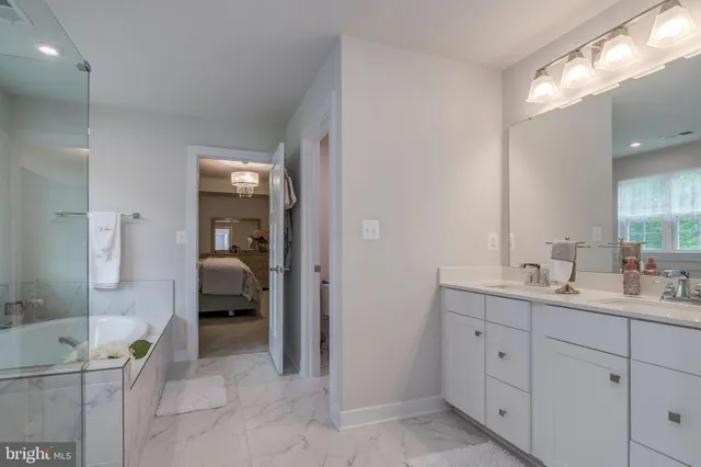 a view of walk in closet with clothes