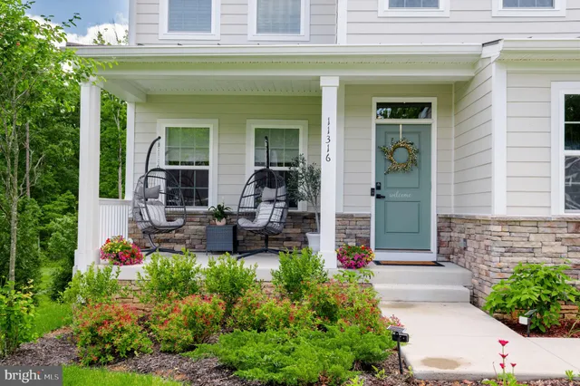 a view of a dining room with furniture and window
