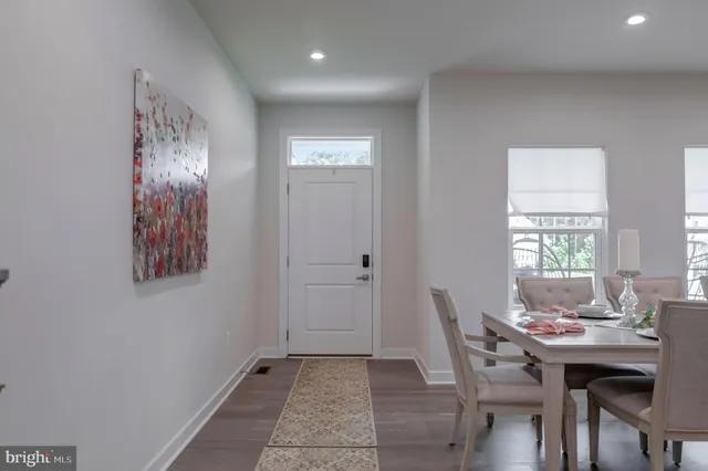 a view of a dining room with furniture and window