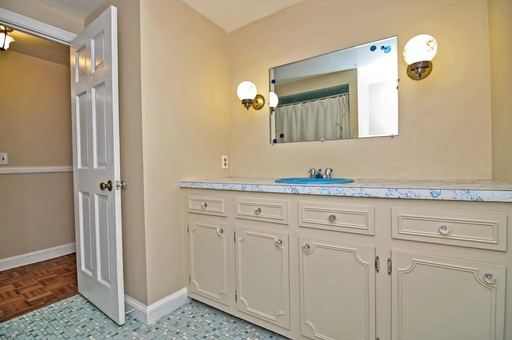 7 Rosedale Drive Bristol, RI 02809 - Photo 12 of 23 a bathroom with a sink and a mirror