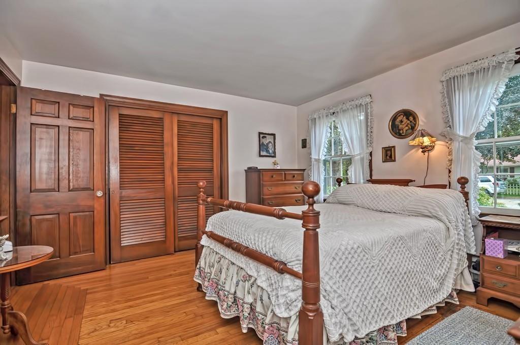 7 Rosedale Drive Bristol, RI 02809 - Photo 15 of 23 a bedroom with a bed and wooden floor