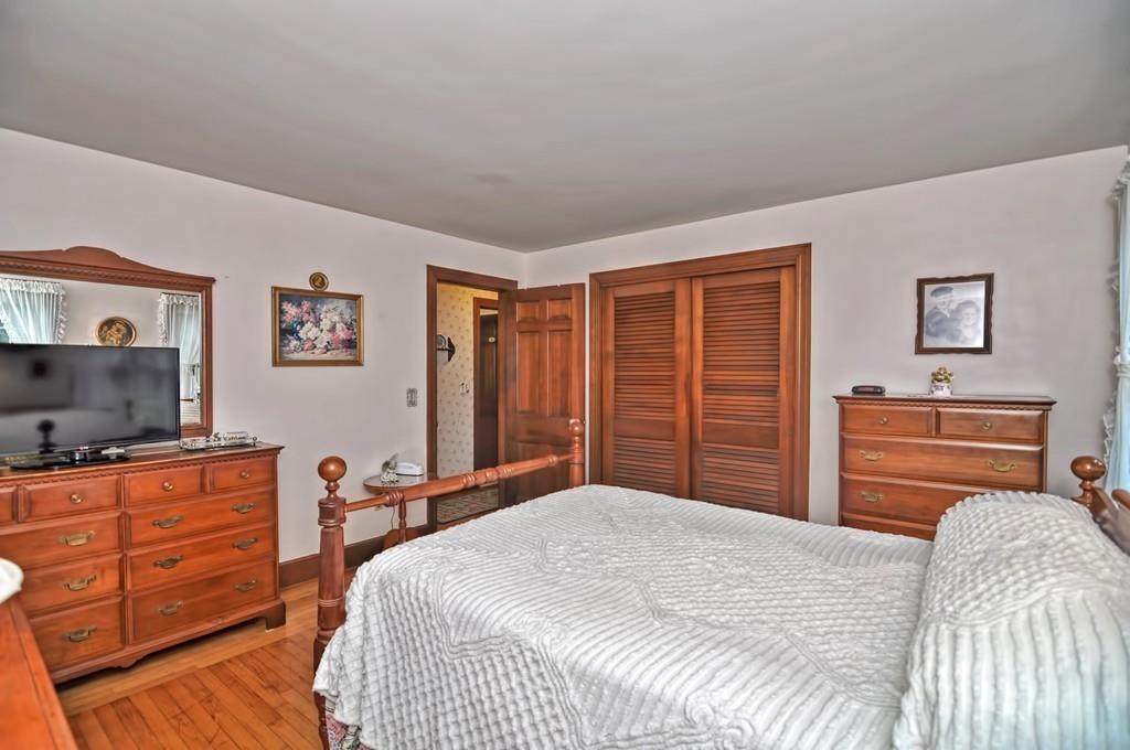 7 Rosedale Drive Bristol, RI 02809 - Photo 16 of 23 a bedroom with a bed and a flat screen tv