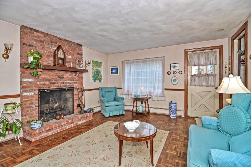 7 Rosedale Drive Bristol, RI 02809 - Photo 7 of 23 a living room with furniture a fireplace and a window