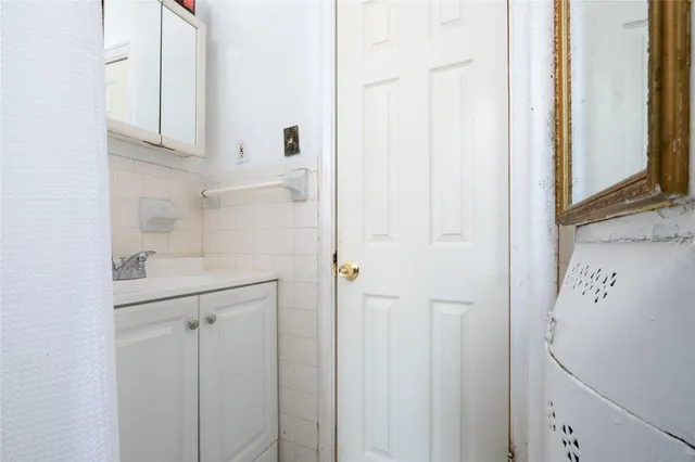 a bathroom with a sink and mirror