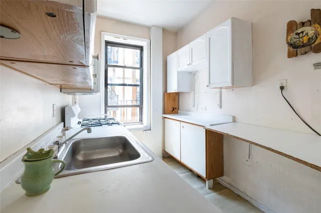 a kitchen with a sink and a stove