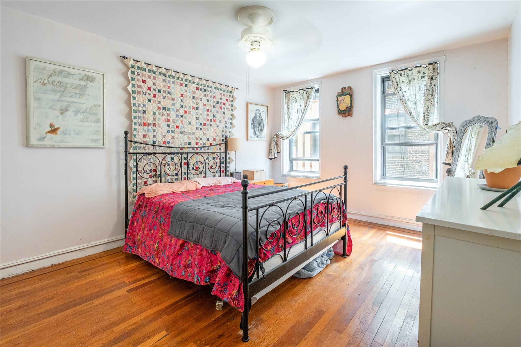 760 Brady Avenue, Unit 417 Bronx, NY 10462 - Photo 19 of 27 a bedroom with a bed and wooden floor