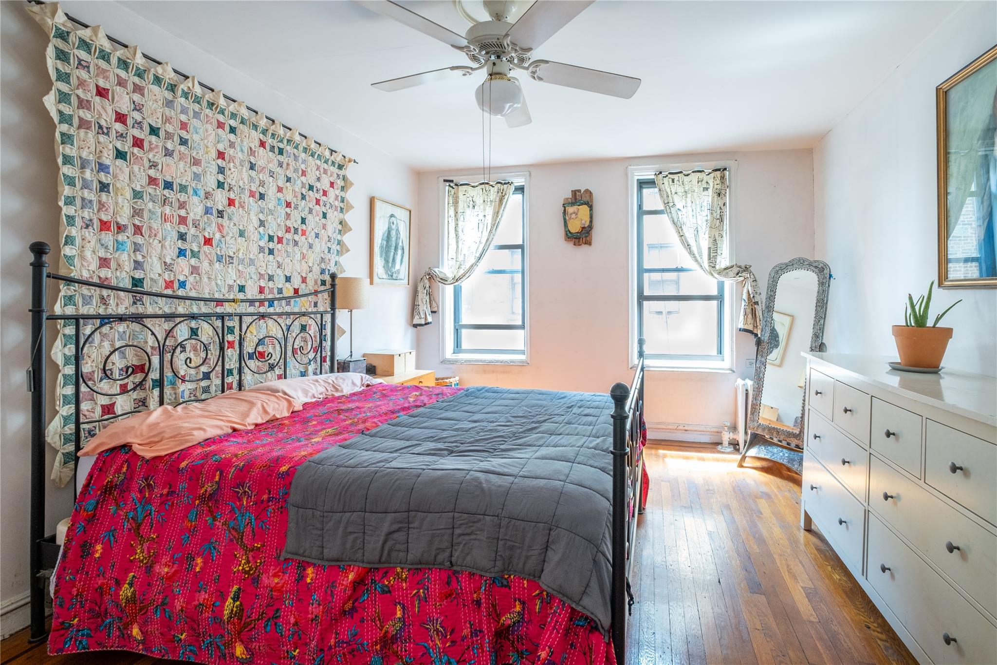 760 Brady Avenue, Unit 417 Bronx, NY 10462 - Photo 20 of 27 a bedroom with a bed and a dresser with the shoe rack