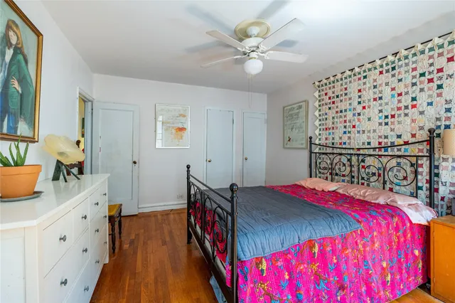 a bed room with a bed and a chandelier