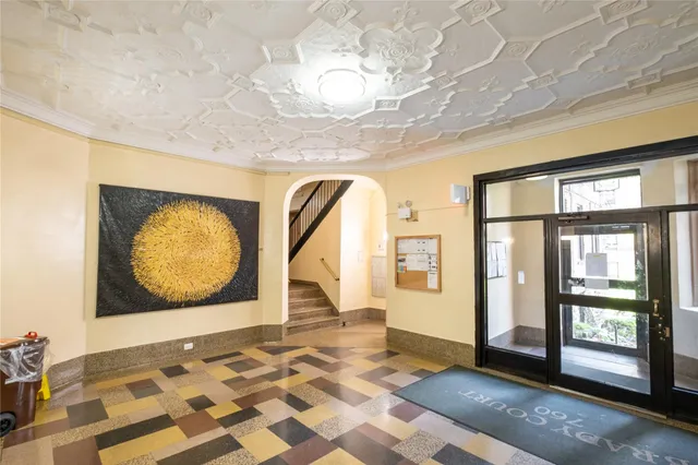 a view of a brick house with windows