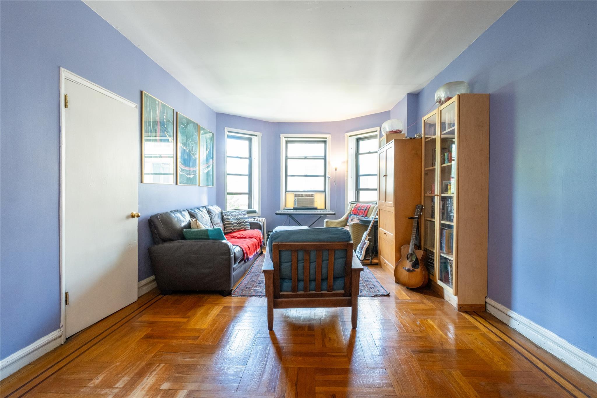 760 Brady Avenue, Unit 417 Bronx, NY 10462 - Photo 9 of 27 a living room with furniture window and wooden floor