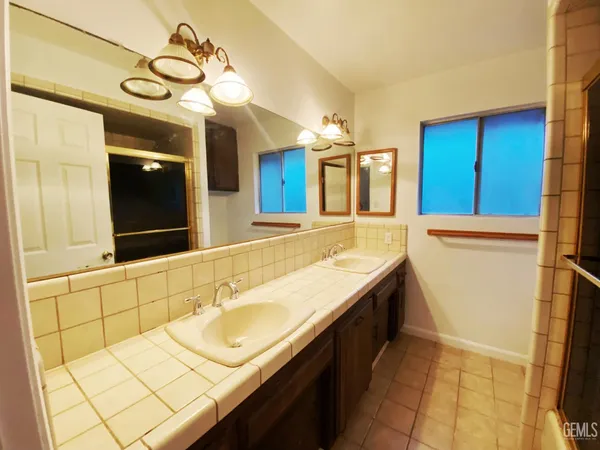 a bathroom with a sink a vanity and a mirror