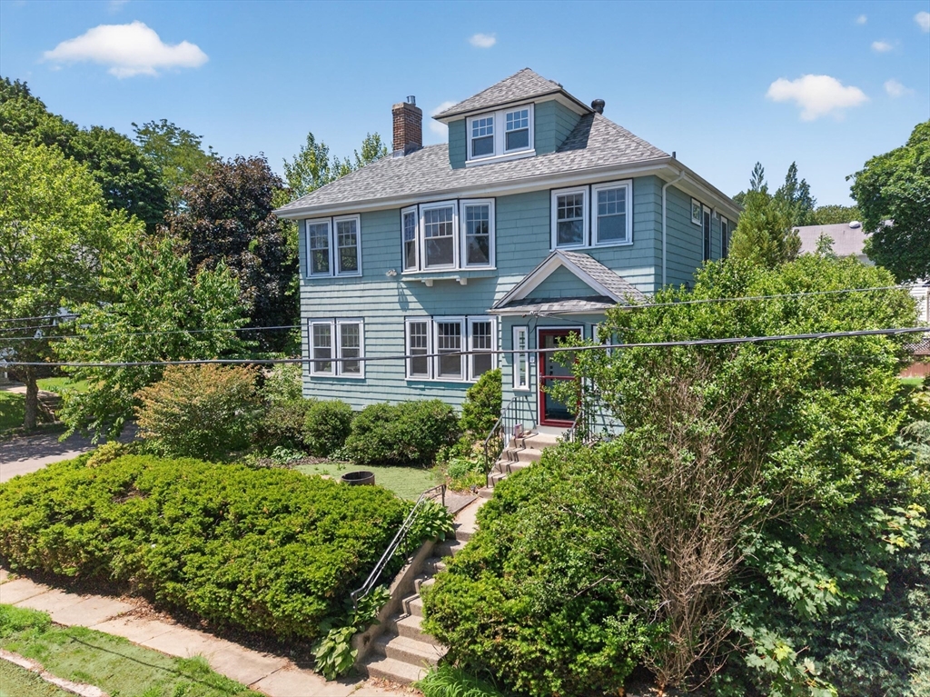 76-78 Lewis Road Belmont, MA 02478 - Photo 1 of 36 a front view of a house with a yard