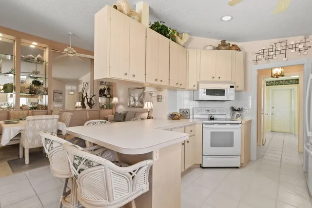 a kitchen with sink cabinets and appliances