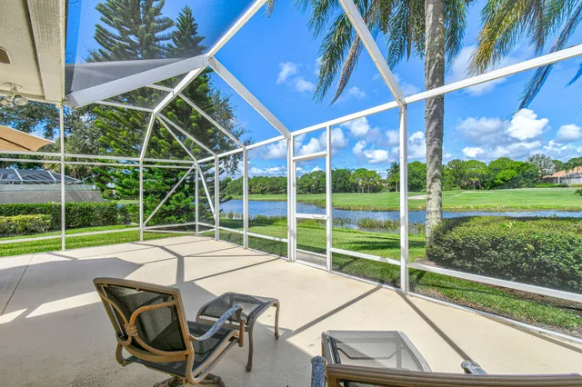 a view of a chair and table in front of a house