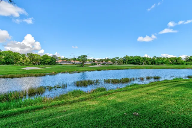 a view of a lake with a big yard