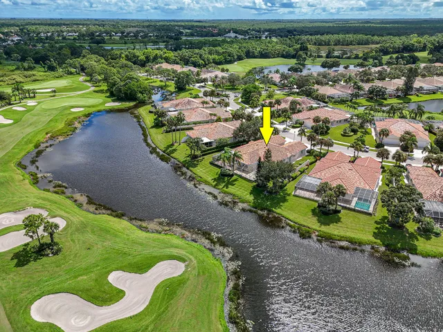 an aerial view of a city with lake view