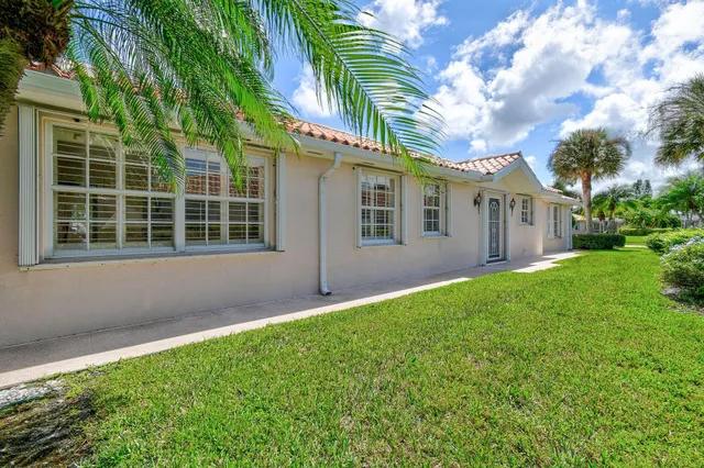 a view of a kitchen with furniture and floor to ceiling window